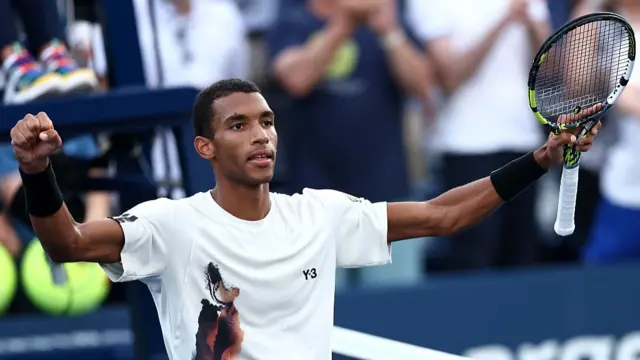 Felix Auger-Aliassime celebrates after his first round win