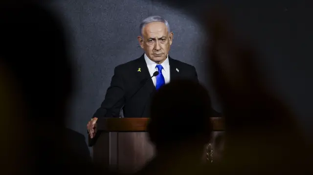 Israeli Prime Minister Benjamin Netanyahu delivers a speech from podium
