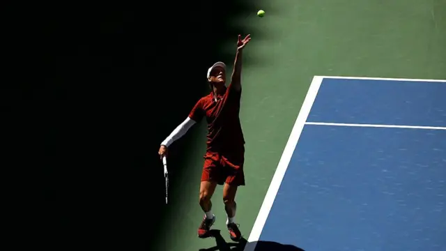 Jannik Sinner of Italy serves