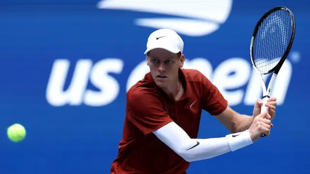 Jannik Sinner of Italy plays a backhand