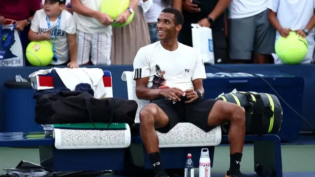 Felix Auger-Aliassime sits on his bench after his first round win