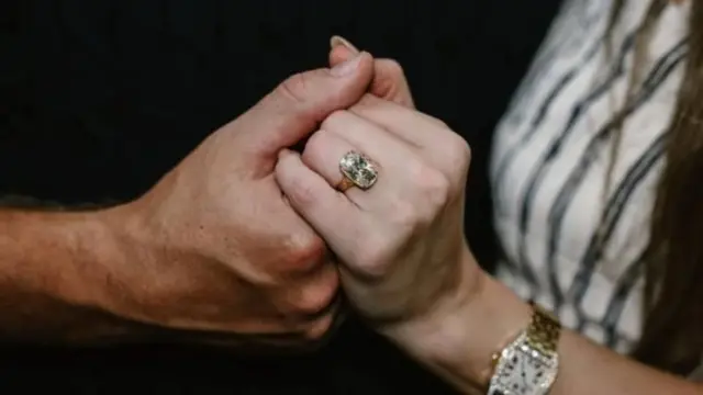 Taylor Swift and Travis Kelce surrounded by flowers
