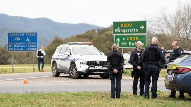 Victorian Police stand at the scene of a shooting in Porepunkah, Victoria, Australia, August 26, 2025
