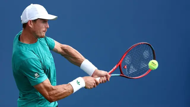 Billy Harris of Great Britain plays a backhand