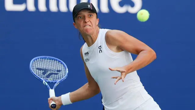 Iga Swiatek plays a forehand return