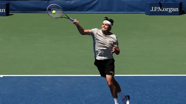 USA's Taylor Fritz plays a forehand winner