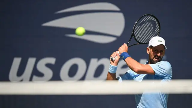 Novak Djokovic plays a return