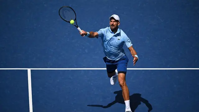 Serbia's Novak Djokovic hits a return to USA's Zachary Svajda