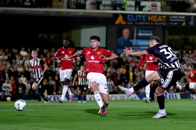 Grimsby Town’s Charles Vernam scores their side's first goal of the game