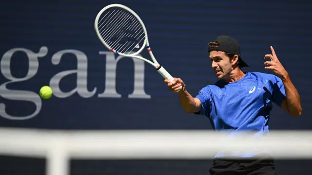 USA's Zachary Svajda plays a forehand