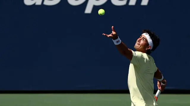 Francisco Comesana of Argentina serves