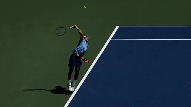 Novak Djokovic of Serbia serves
