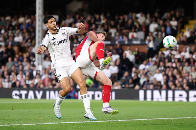 George Tanner of Bristol City scores an own goal whilst under pressure from Raul Jimenez