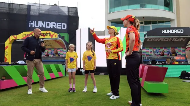 Ash Gardner of Trent Rockets tosses the coin alongside Ellyse Perry of Birmingham Phoenix