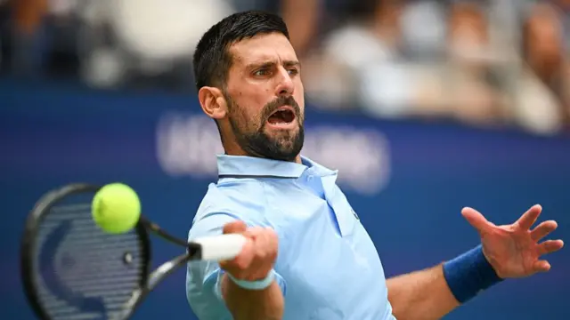 Novak Djokovic hits a forehand