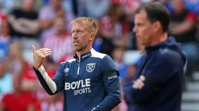 West Ham manager Graham Potter and Sunderland counterpart Regis le Bris stood on the touchline