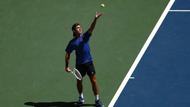 Zachary Svajda of the United States serves