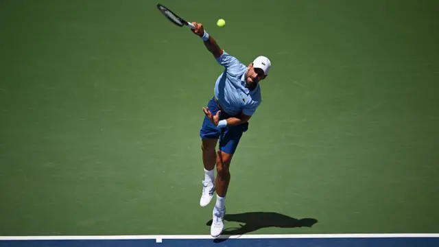 Novak Djokovic of Serbia serves