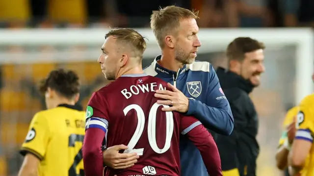 Jarrod Bowen hugs manager Graham Potter after West Ham's EFL Cup defeat at Wolves