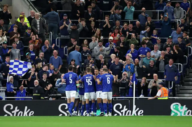 Everton players celebrate Charly Alcaraz (not pictured) scoring.