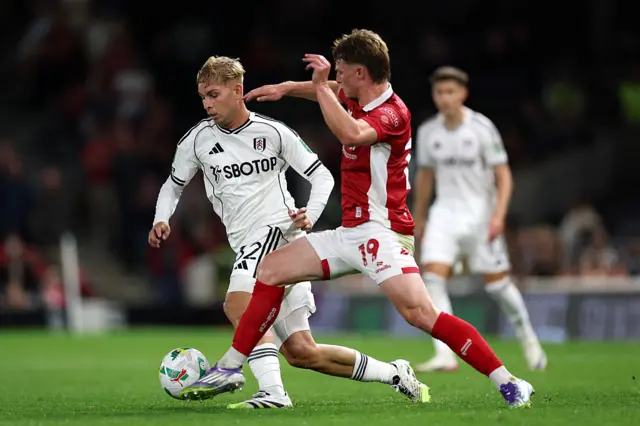 Emile Smith Rowe of Fulham is challenged by George Tanner of Bristol City during the Carabao Cup Second Round match between Fulham and Bristol City at Craven Cottage on August 27, 2025 in London, England.