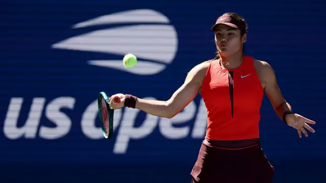 Emma Raducanu hits a forehand