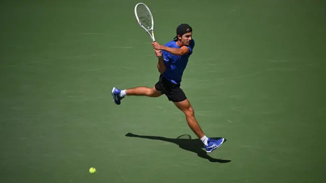 USA's Zachary Svajda hits a backhand