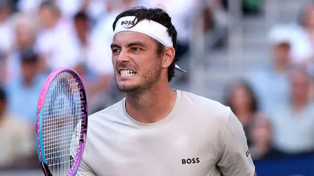 Taylor Fritz of the United States reacts after winning the third set