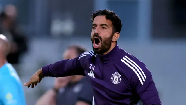 Manchester United boss Ruben Amorim gestures to his players during their EFL Cup defeat by Grimsby