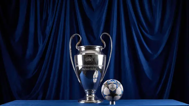 The Champions League trophy with the 2025-26 Champions League ball