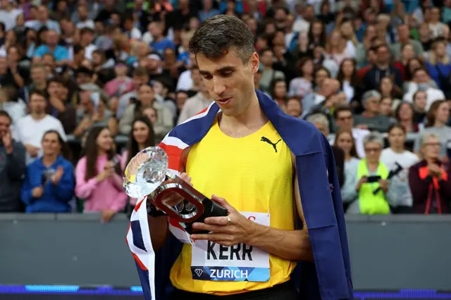 Hamish Kerr looks at his Diamond League trophy