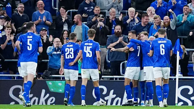 Everton players congratulate Carlos Alcaraz after he scores in their EFL Cup win over Mansfield