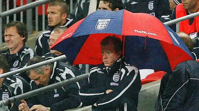 Steve McLaren holding an umbrella as he watches from the touchlines during a Euro 2008 qualifier against Croatia at Wembley