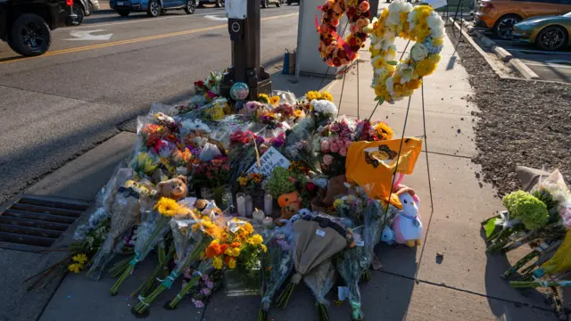 Flowers and other offerings sit at an intersection near the Annunciation Church, which is a home to an elementary school and was the scene of a shooting the day before, in Minneapolis, Minnesota, U.S. August 28, 2025.