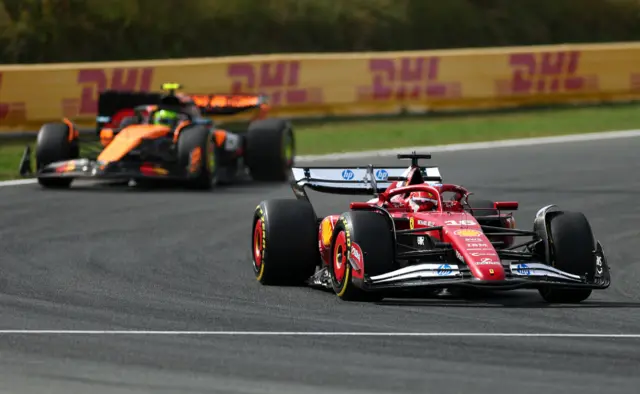 Charles Leclerc with Lando Norris in the background