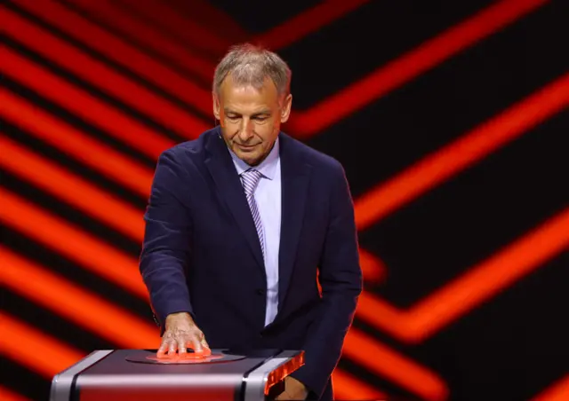 Former footballer Jurgen Klinsmann presses a button during the UEFA Europa draw