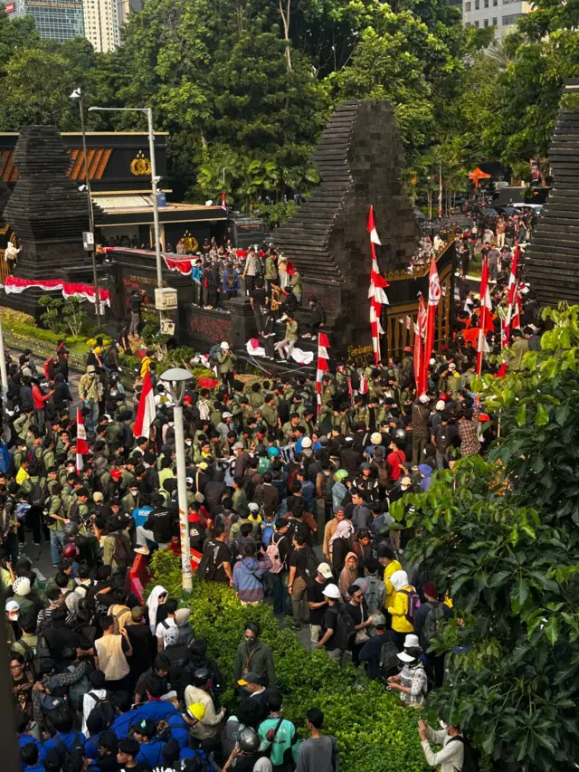 Protesters gather outside Polda Metro Jaya in Jakarta Indonesia