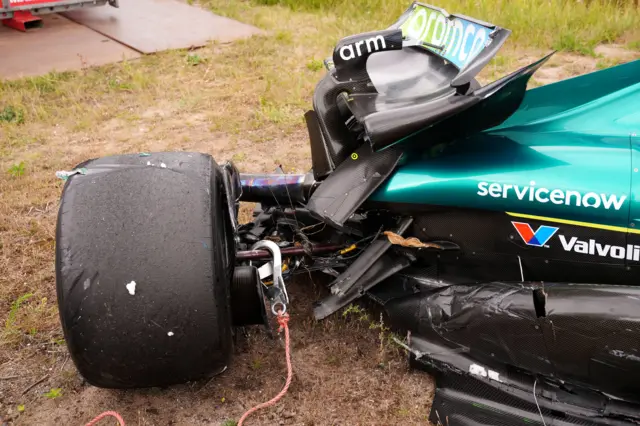 A hook attached to the damaged Aston Martin of Lance Stroll after he crashed during Dutch Grand Prix second practice