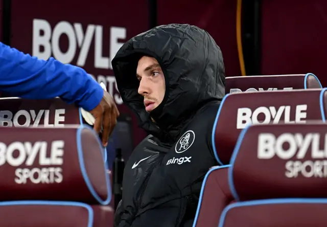 Cole Palmer of Chelsea is seen sat on the bench after picking up an injury during the warm up prior to the Premier League match between West Ham United and Chelsea at London Stadium on August 22, 2025 in London, England.