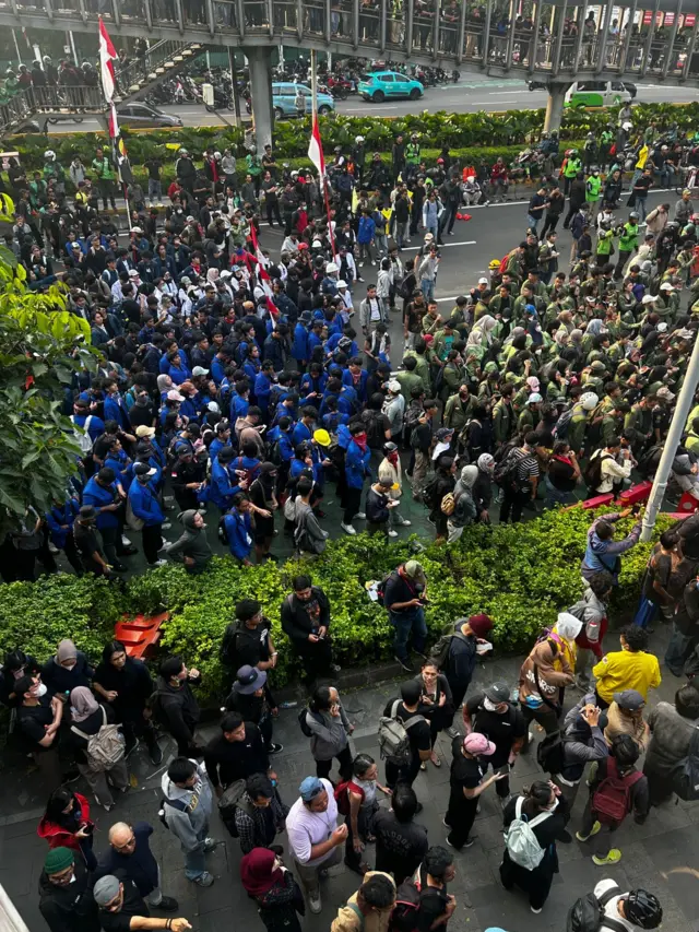 Protesters gather outside Polda Metro Jaya in Jakarta Indonesia