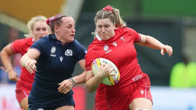 Gwen Crabb running with the ball for Wales against Scotland at the World Cup