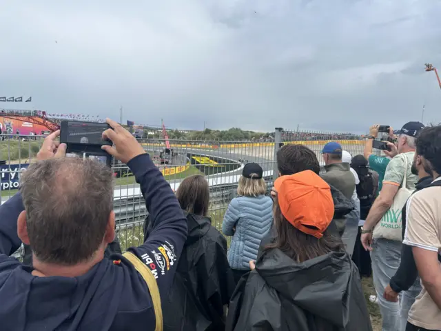 Fans take pictures