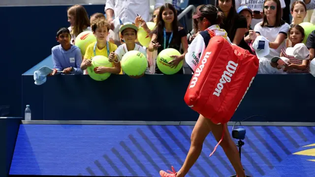 Emma Raducanu leaves the court