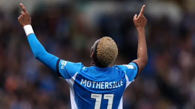 Malik Mothersille celebrates for Stockport County
