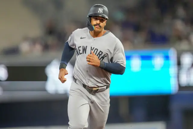 Trent Grisham of the New York Yankees rounds the bases after hitting a home run
