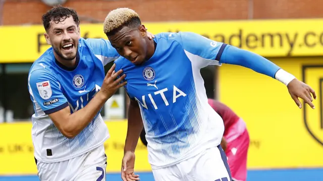Malik Mothersille celebrates his goal for Stockport against Bolton