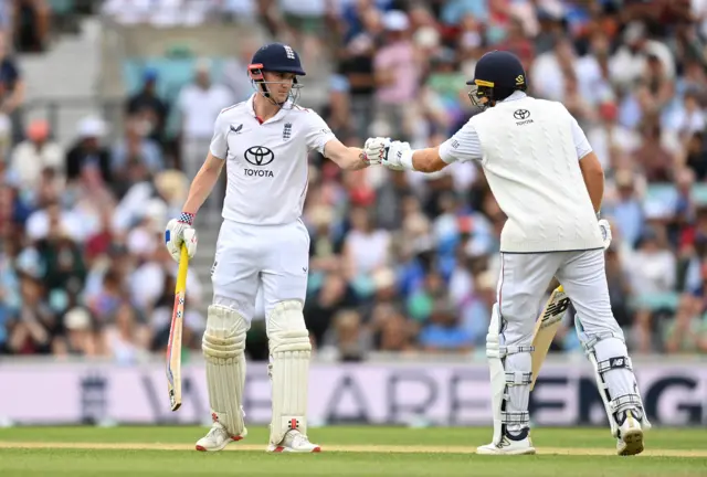 Harry Brook and Joe Root punch gloves