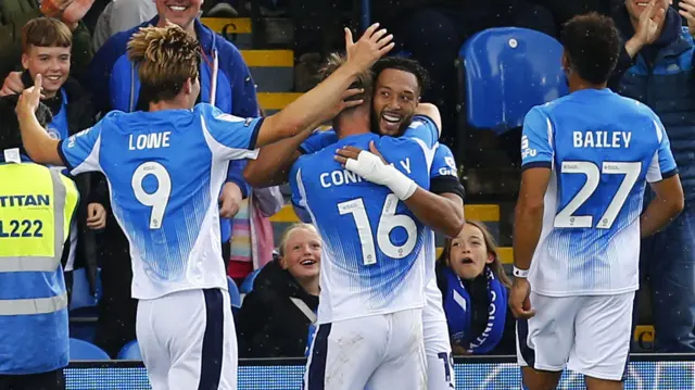 Kyle Wootton celebrates his goal for Stockport against Bolton