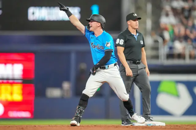 Troy Johnston of the Miami Marlins celebrates after hitting a RBI double