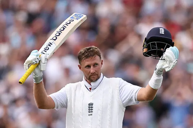 Joe Root celebrates his century